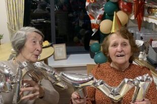 Residents and team members celebrate the new year at Abbey Wood Lodge