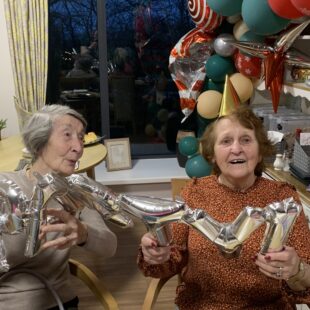 Residents and team members celebrate the new year at Abbey Wood Lodge